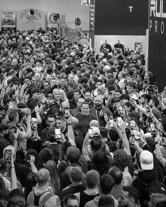 Bronze sculpture of man flexing biceps.