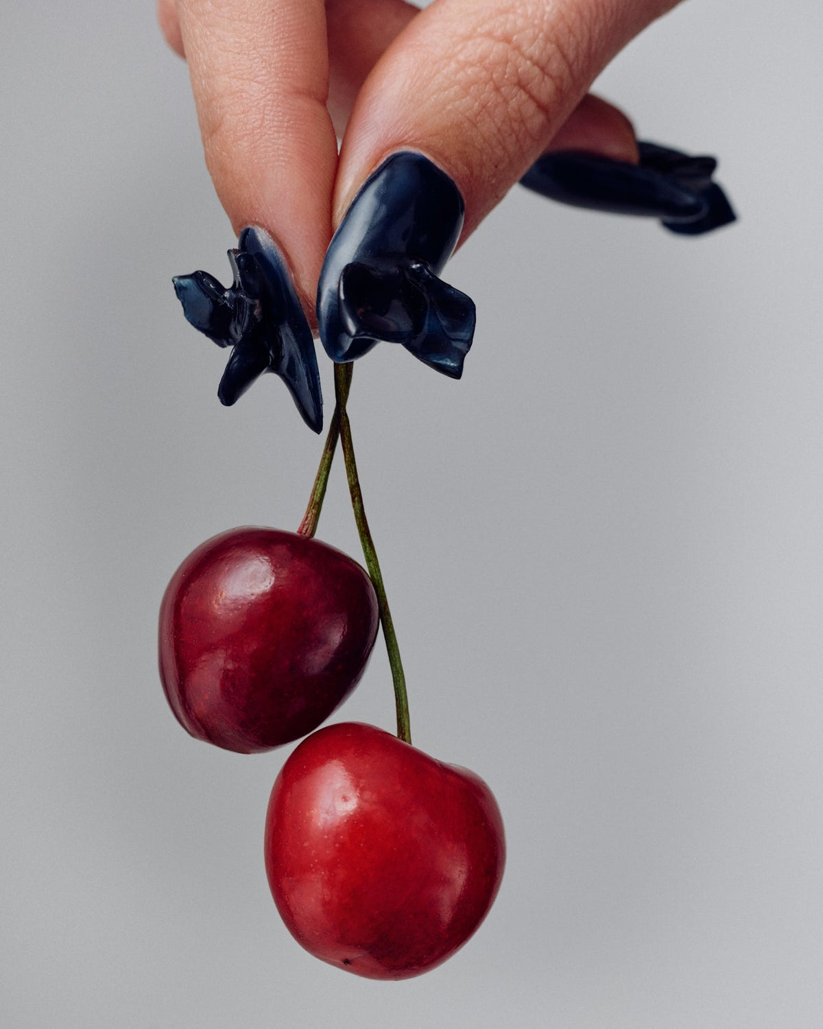 Woman holding cherries