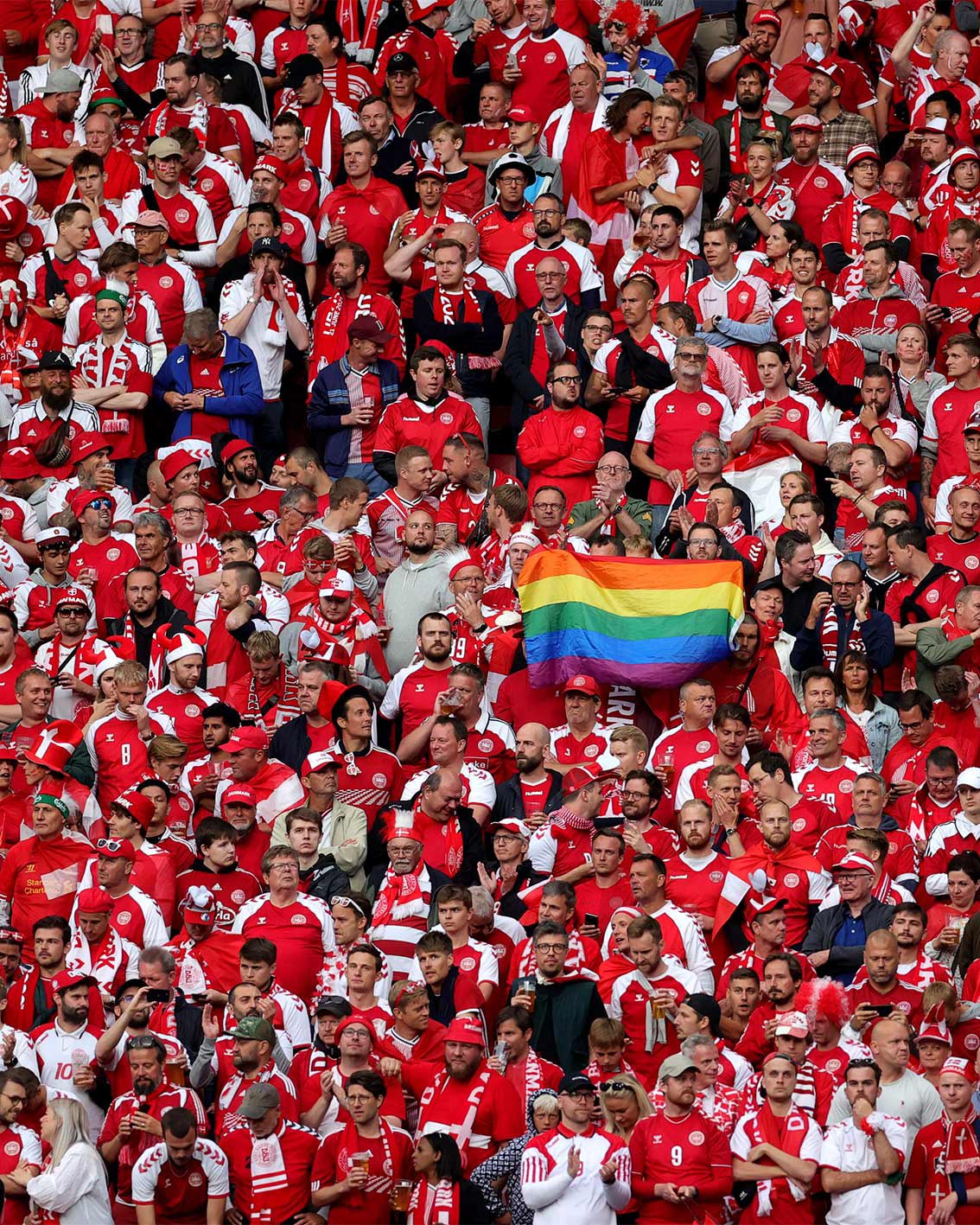 Photo of a crowd with a Pride flag