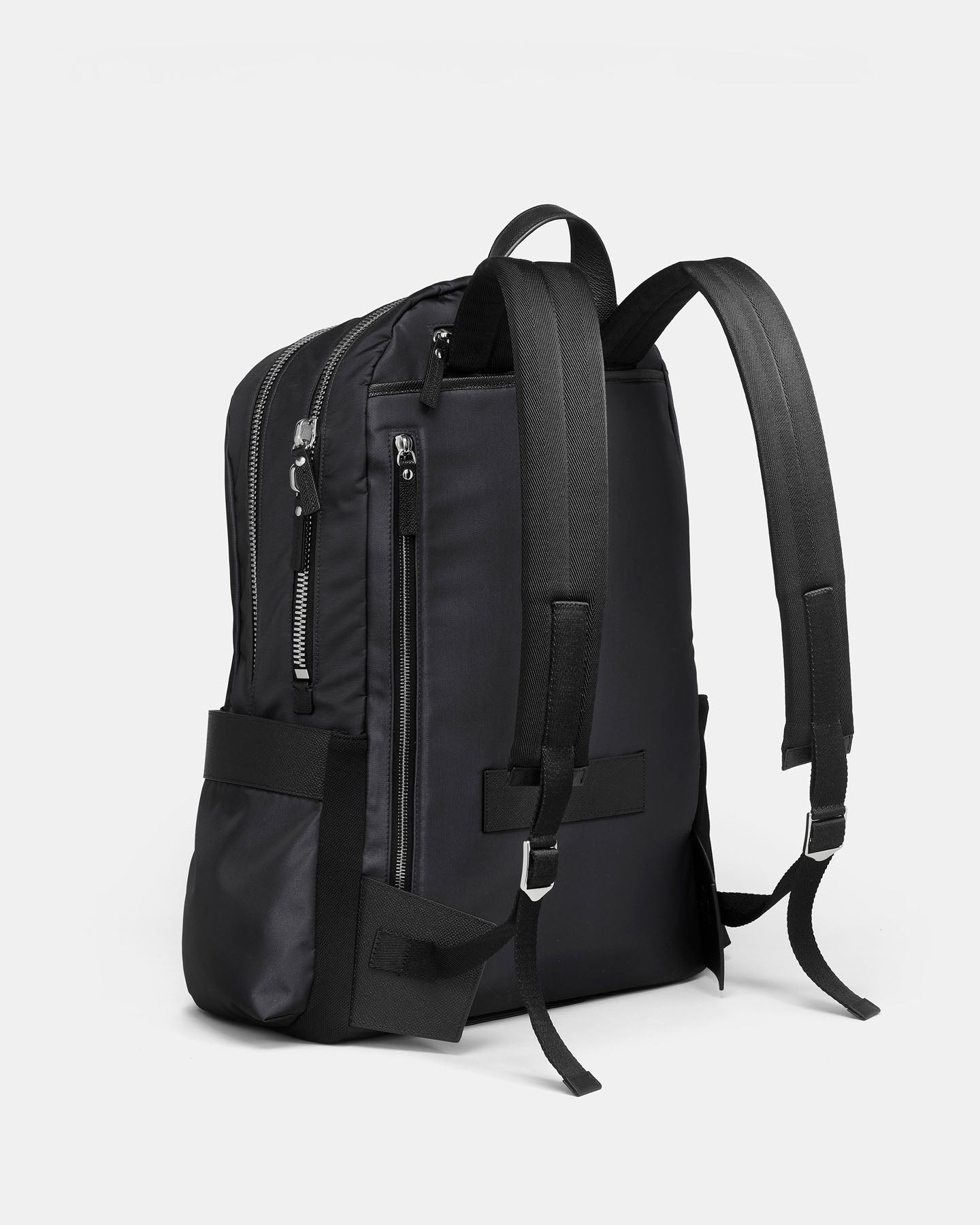 Black backpack on a light gray background