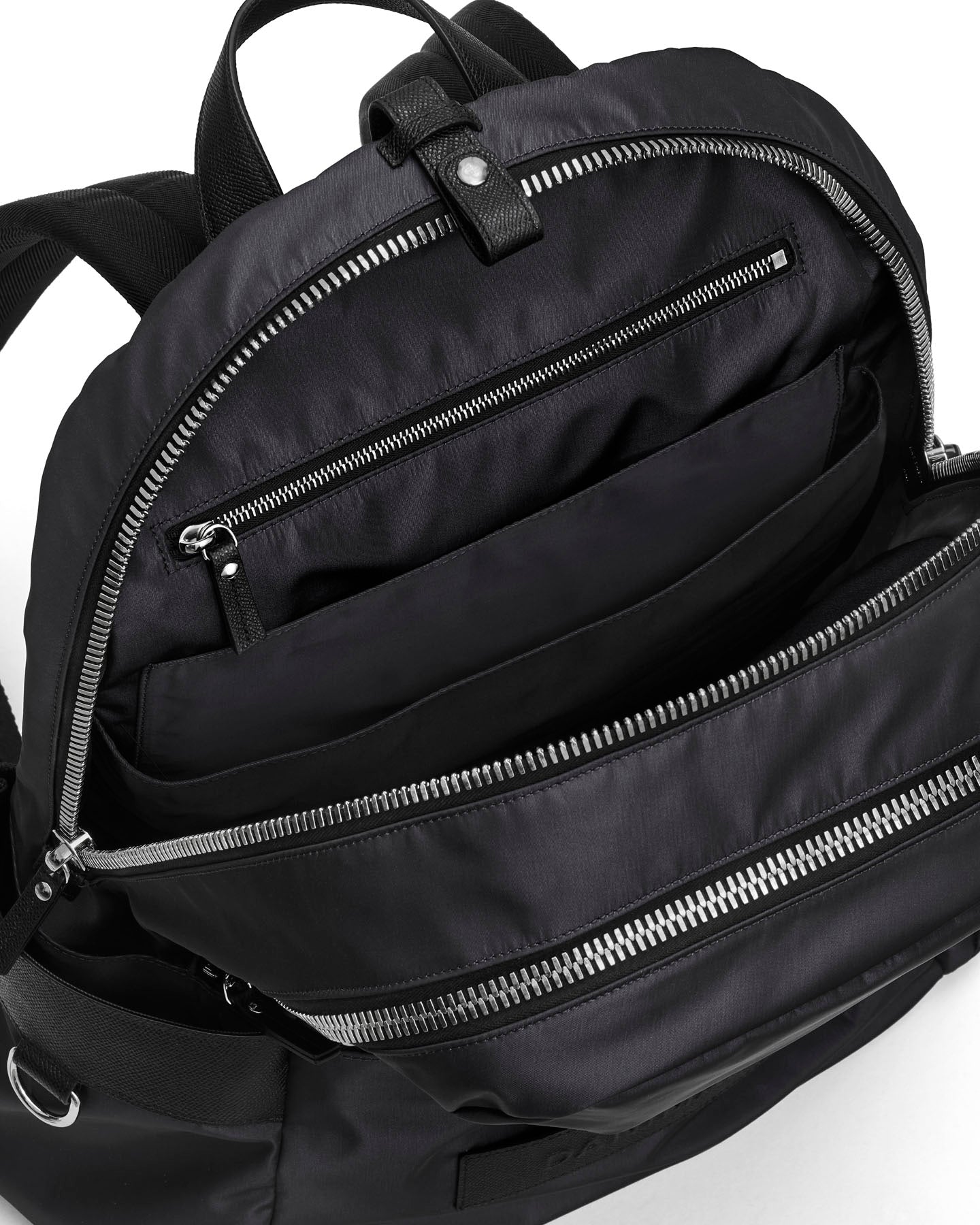 Black backpack with multiple zippers on a white background