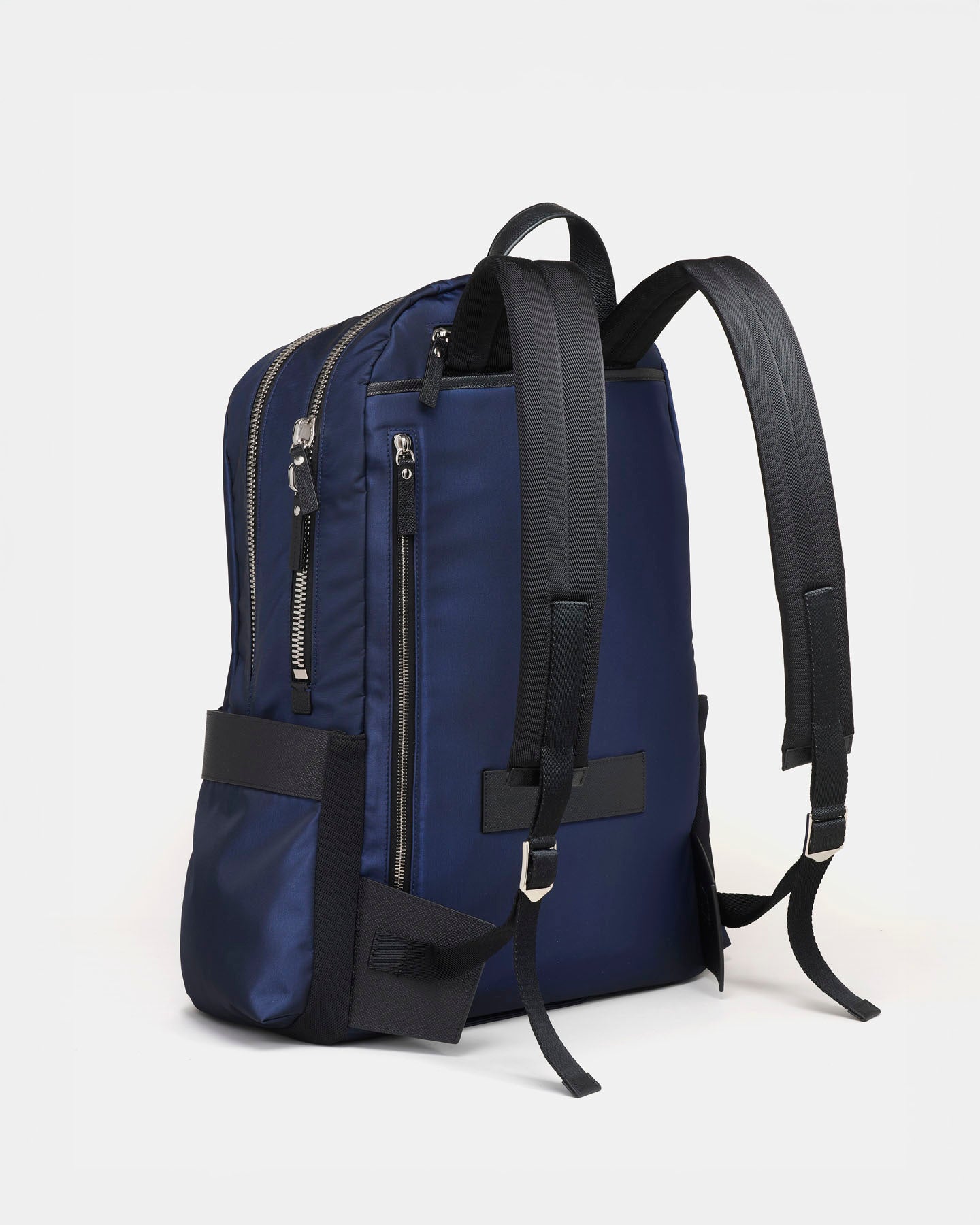 Blue backpack with black straps on a white background