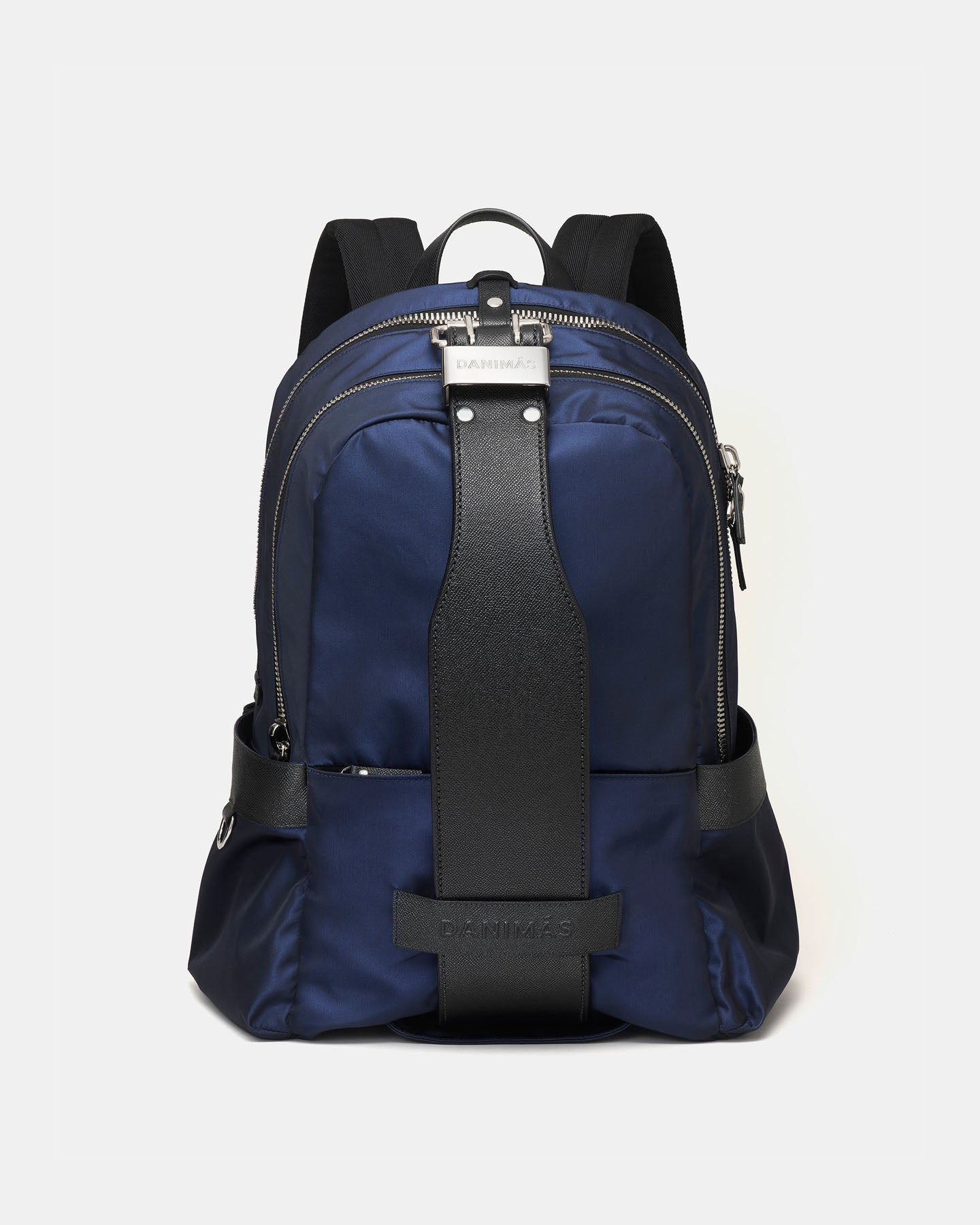 Blue backpack with black straps on a light gray background