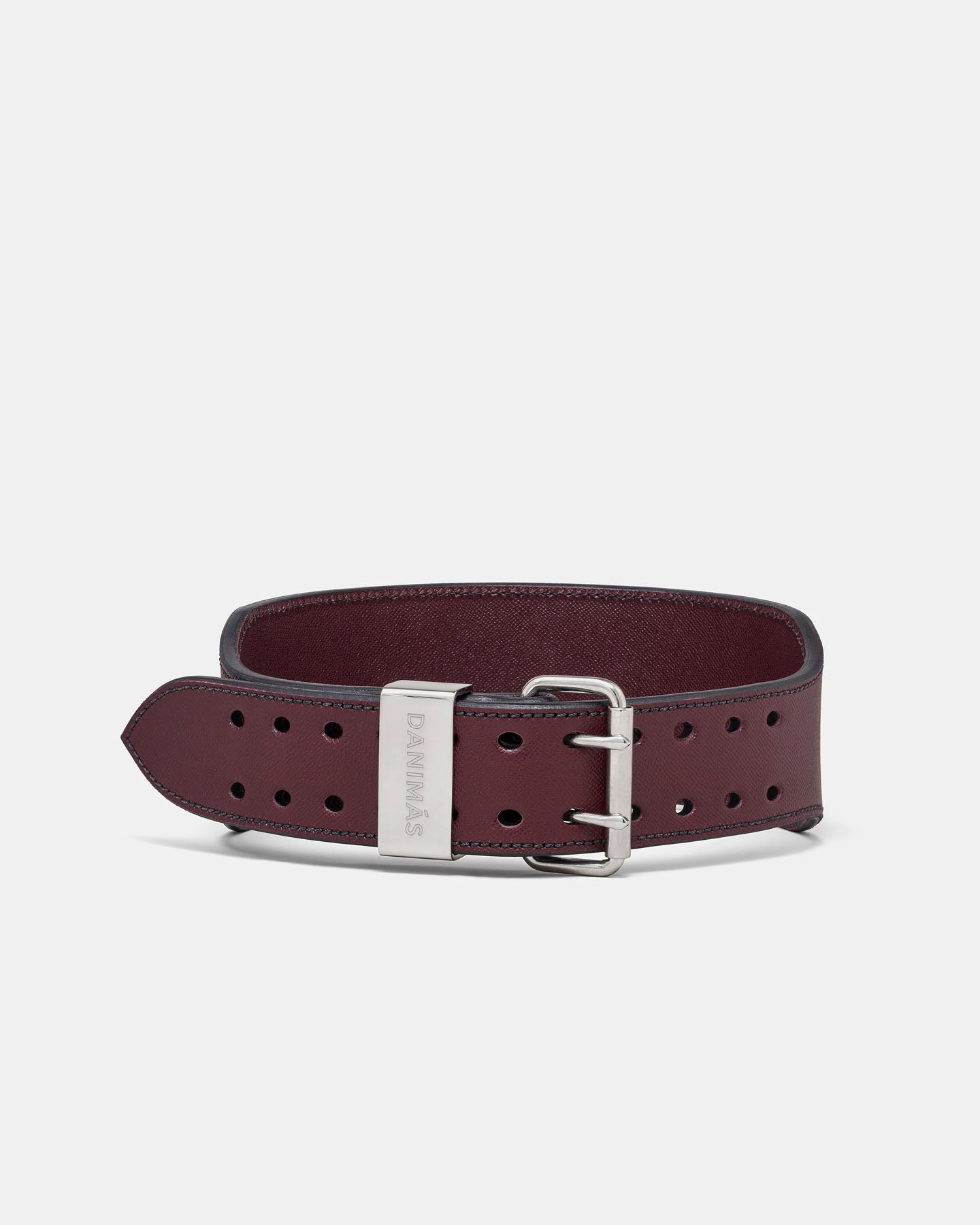 Burgundy leather belt with silver buckle on a light gray background