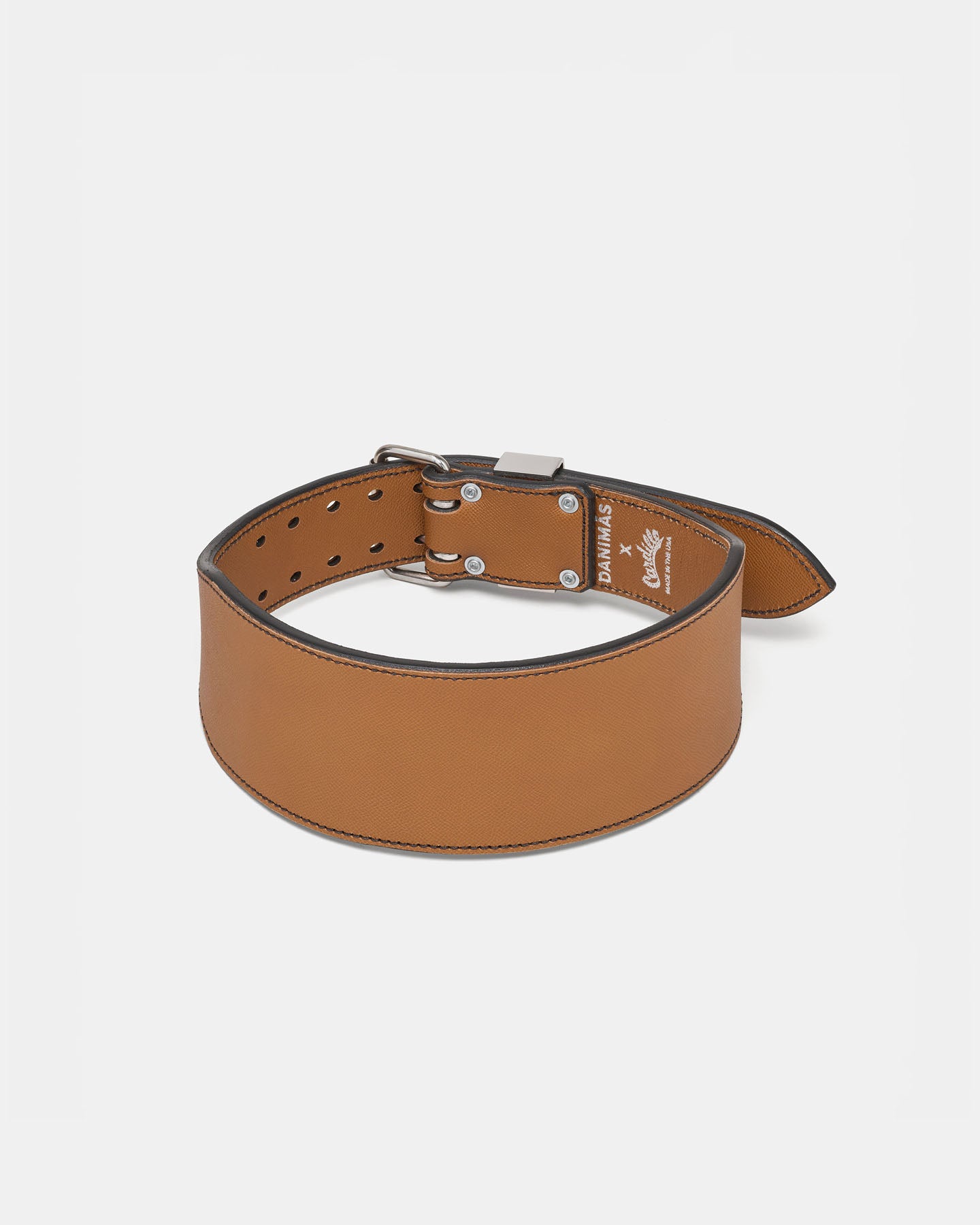 Caramel leather dog collar on a light gray background