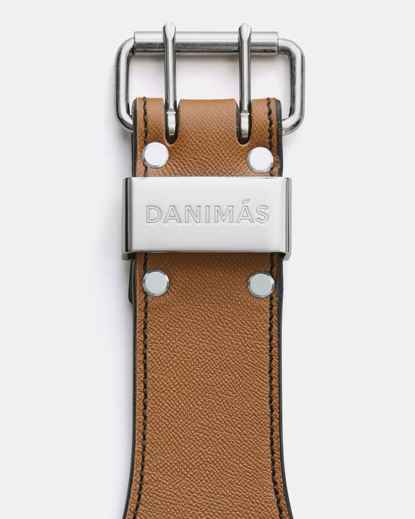 Caramel leather belt with silver buckle and 'Danimas' branding on a white background