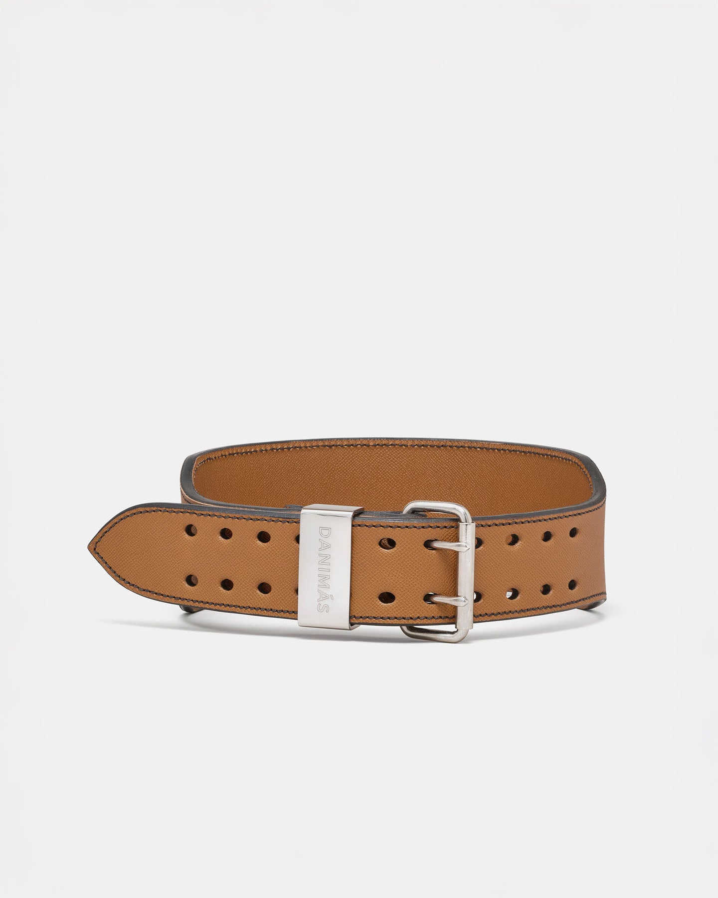 Caramel leather belt with silver buckle on a light gray background