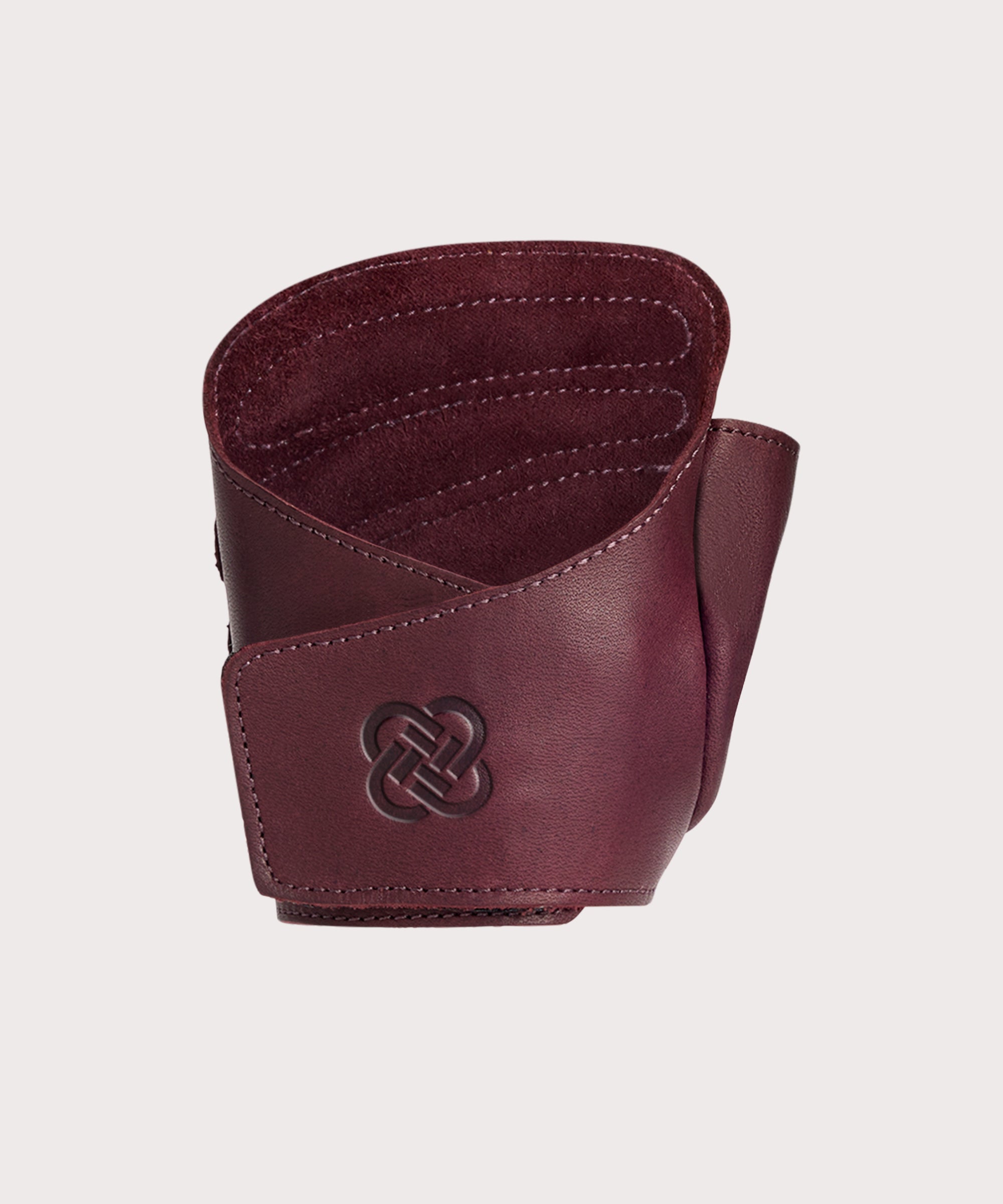 One singular "The Wrap" burgundy colored leather weight lifting glove.