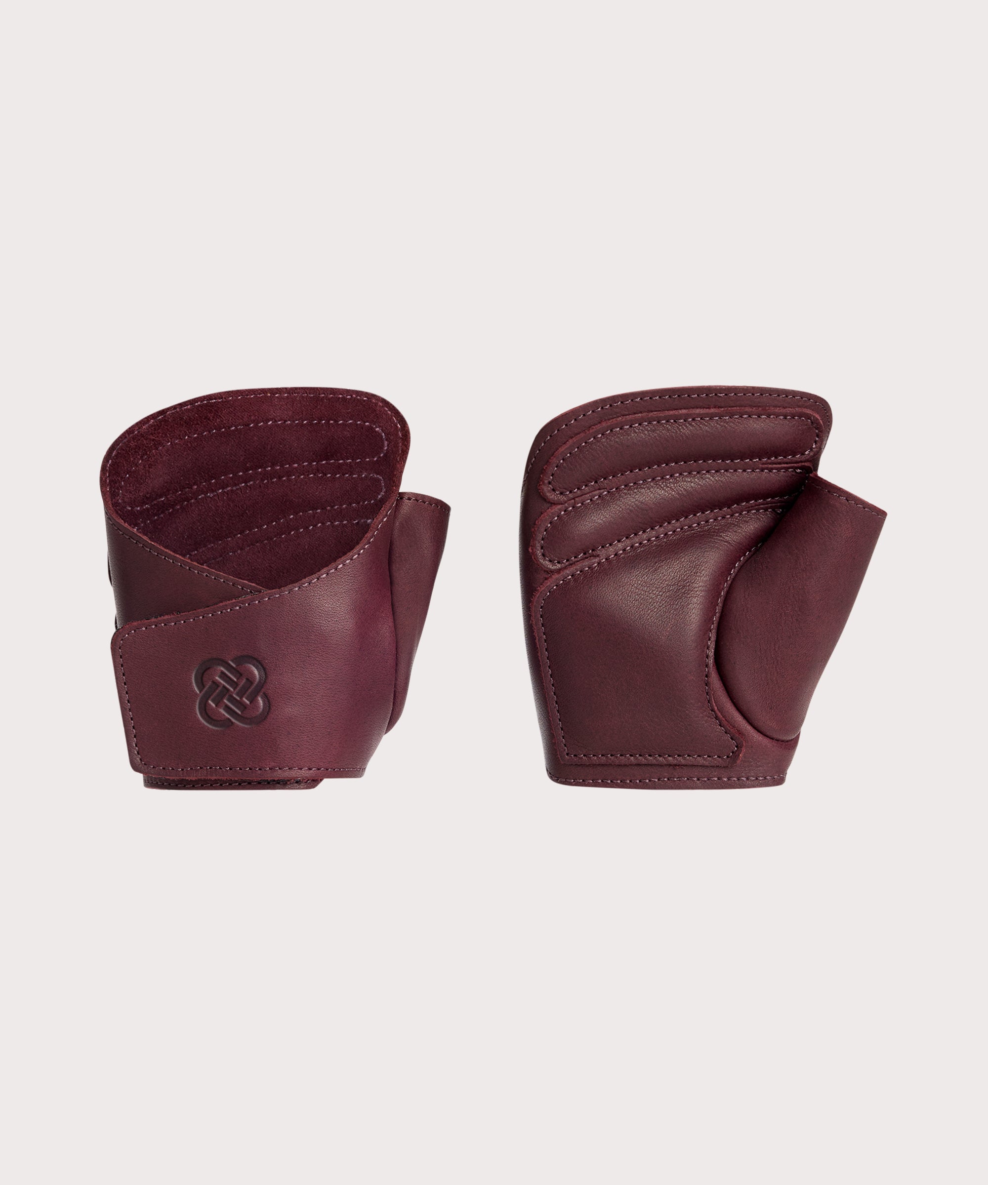 Pair of "The Wrap" burgundy colored weight lifting gloves.