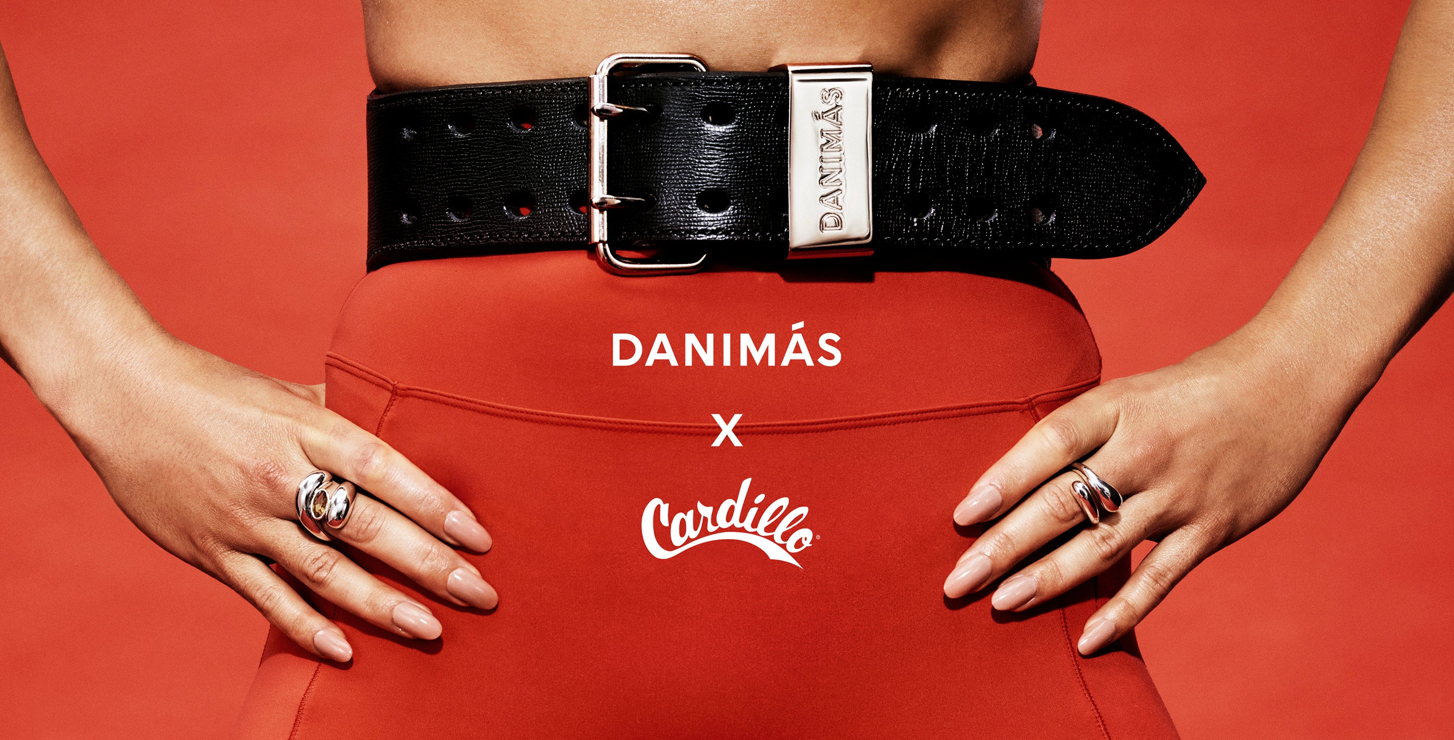 Red leggings with a black belt and the 'Danimas' and 'Cardillo' branding on a red background