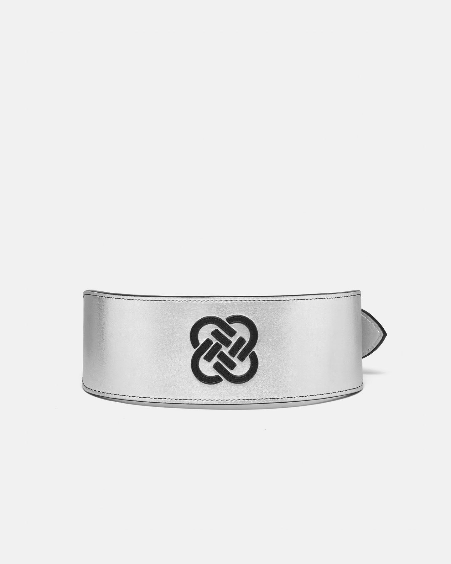 Silver bracelet with a black knot design on a white background