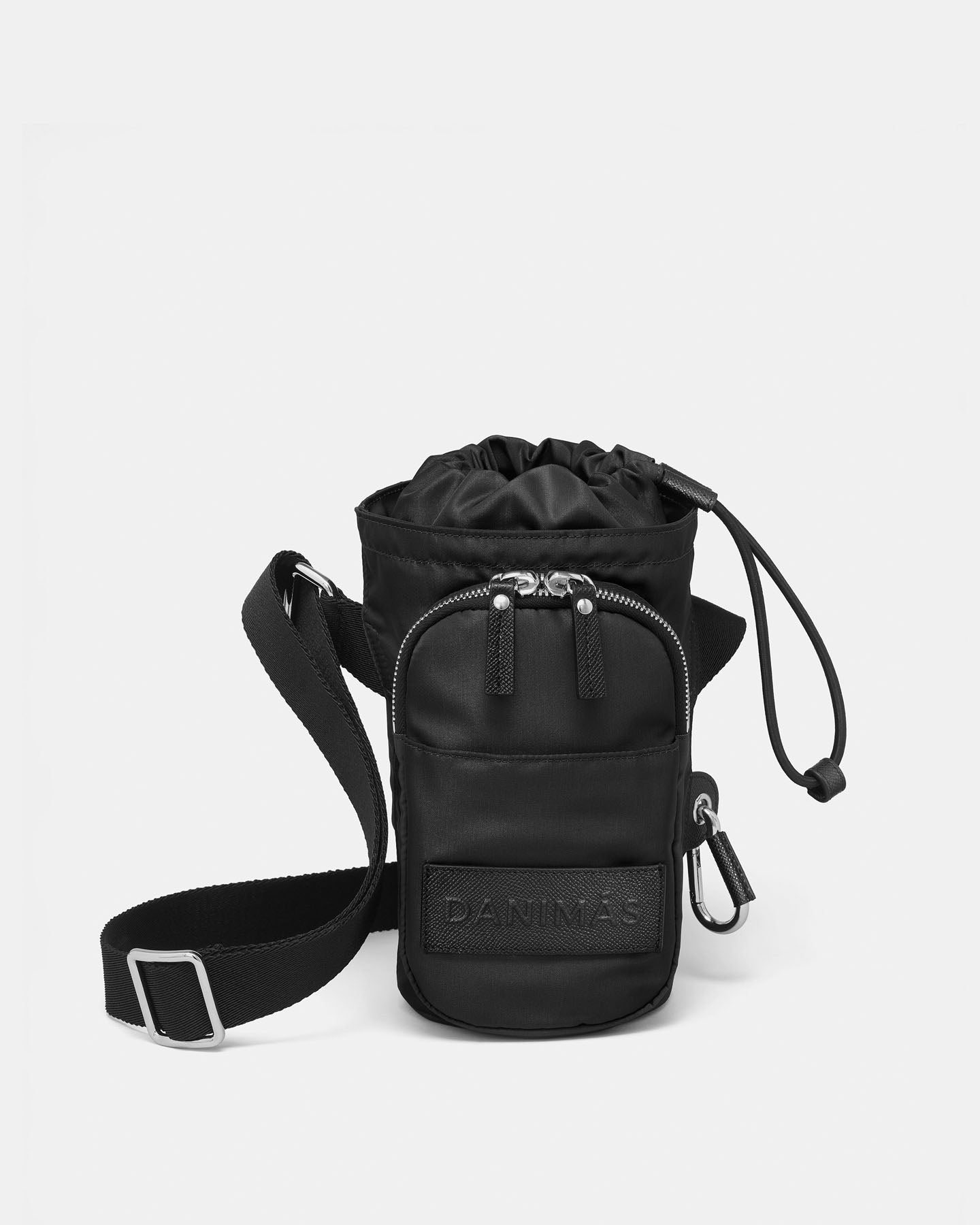 Black crossbody water bottle bag with drawstring top on a white background