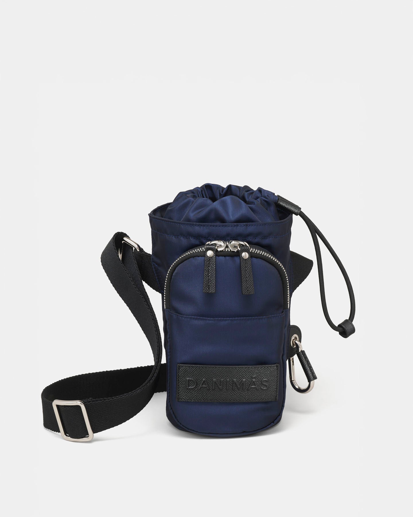 Navy blue crossbody water bottle bag with drawstring top on a white background